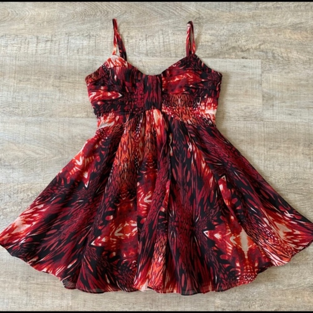 Bebe Red, black and white dress with flare at bottom.